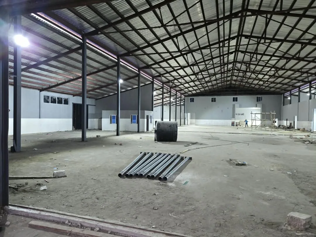 Large factory interior undergoing renovation in Nigeria