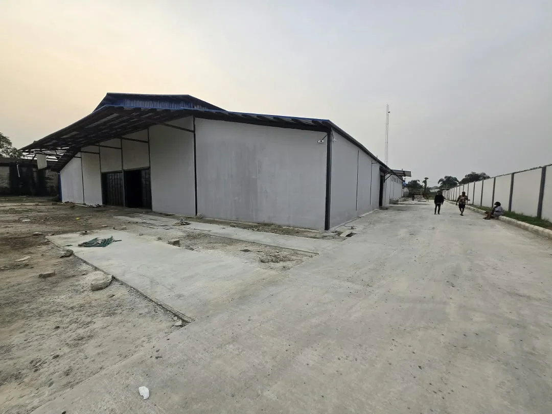 Factory exterior after wall and roof work began
