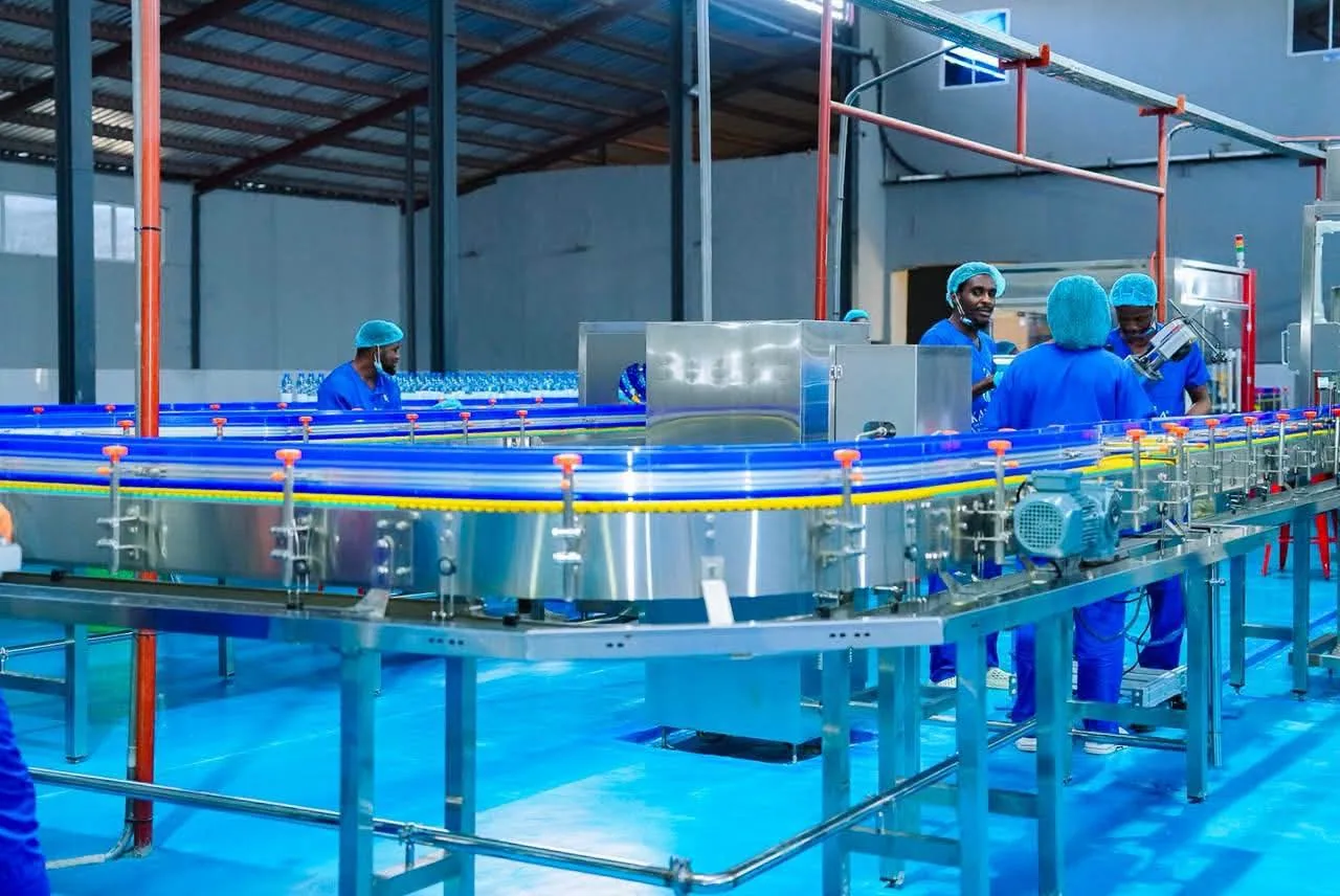 Kaybi staff alongside the production line