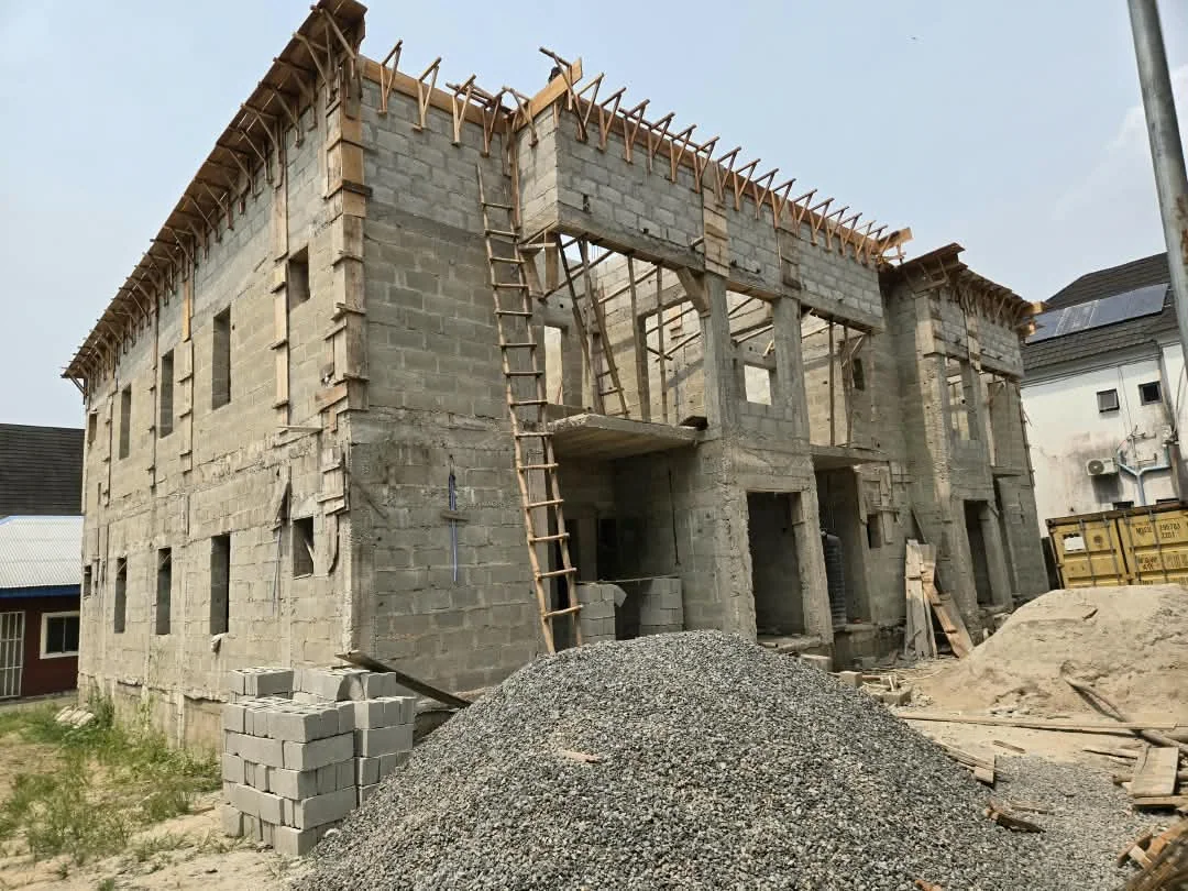 Front of a large blockwork building under construction