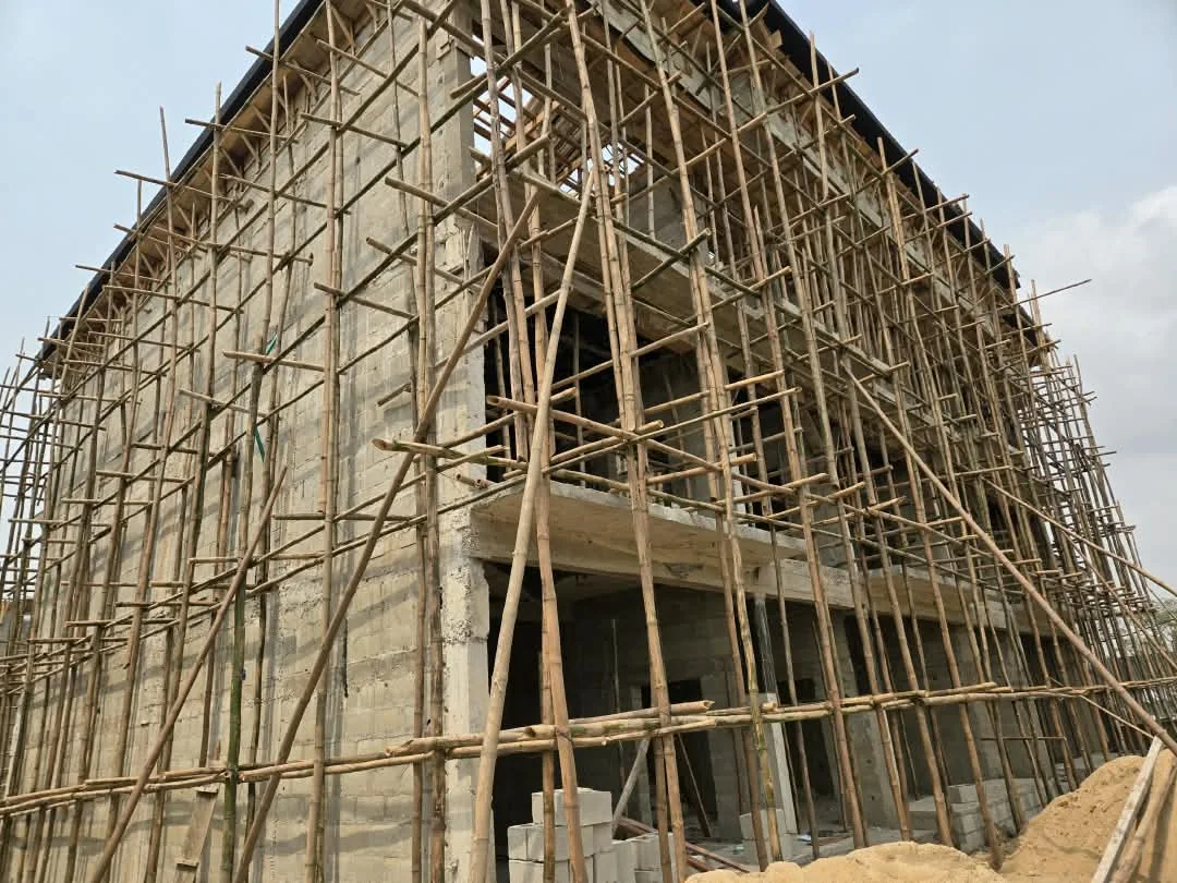 Building wrapped in bamboo scaffolding