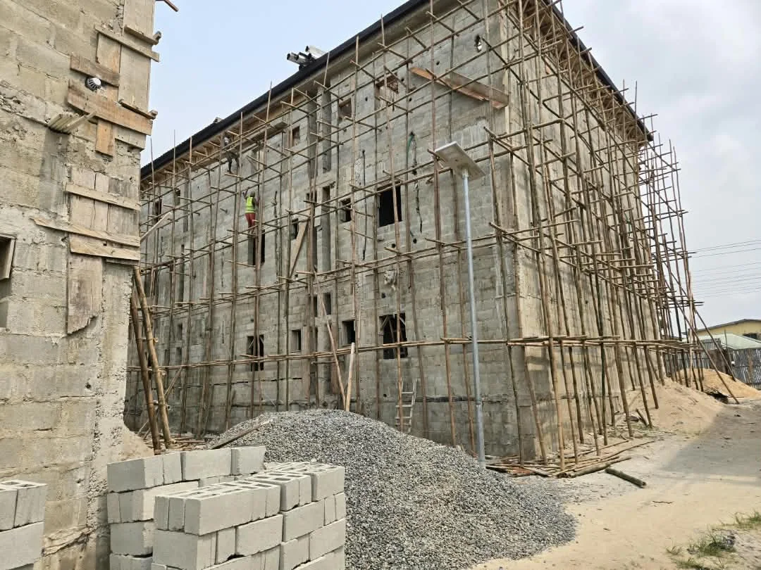 Long side elevation with scaffolding during construction